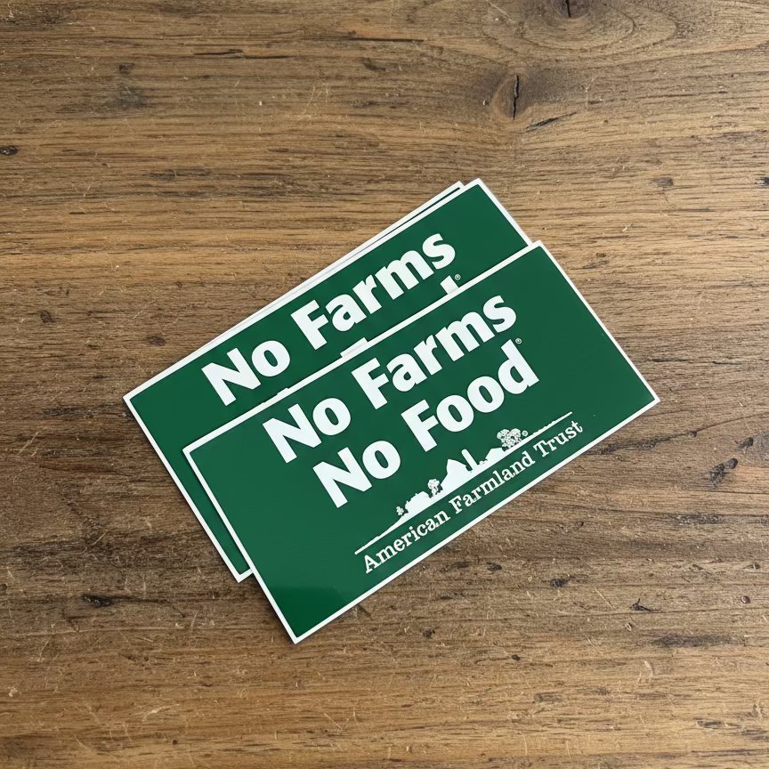 Green Bumper Sticker with white writing, "No Farms No Food."