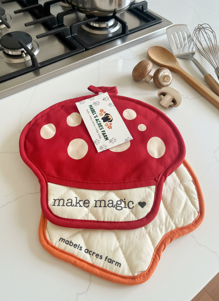 Red mushroom-shaped pot holder with 'make magic' text and Mabel's Acres Farm branding.